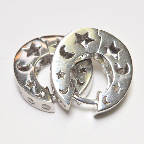 18K white gold hoop earrings with 0.23ct round diamonds, weighing 9.2 grams, by Chique Jewelry.