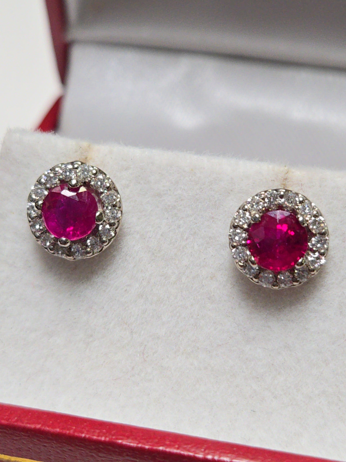 14K white gold two-stone ruby stud earrings with 0.97ct round rubies, crafted by Chique Jewelry.