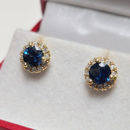14K gold two-stone stud earrings featuring 1.3ct round blue sapphires by Chique Jewelry, with a sleek, polished finish.