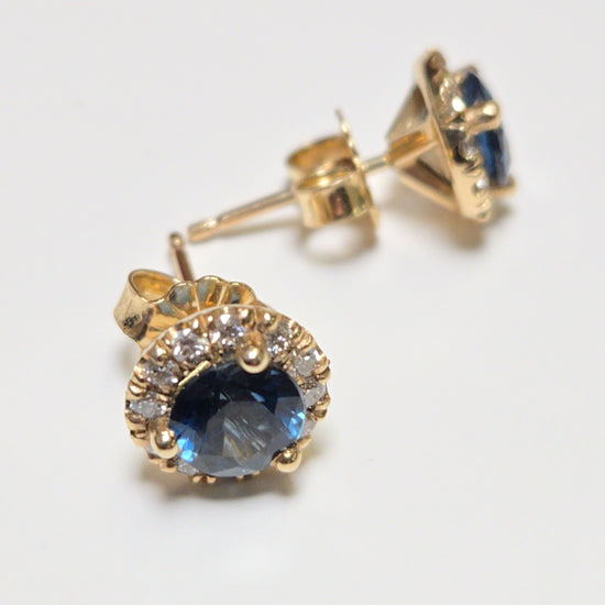 14K gold two-stone stud earrings featuring 1.3ct round blue sapphires, from Chique Jewelry, with a sleek, elegant design.