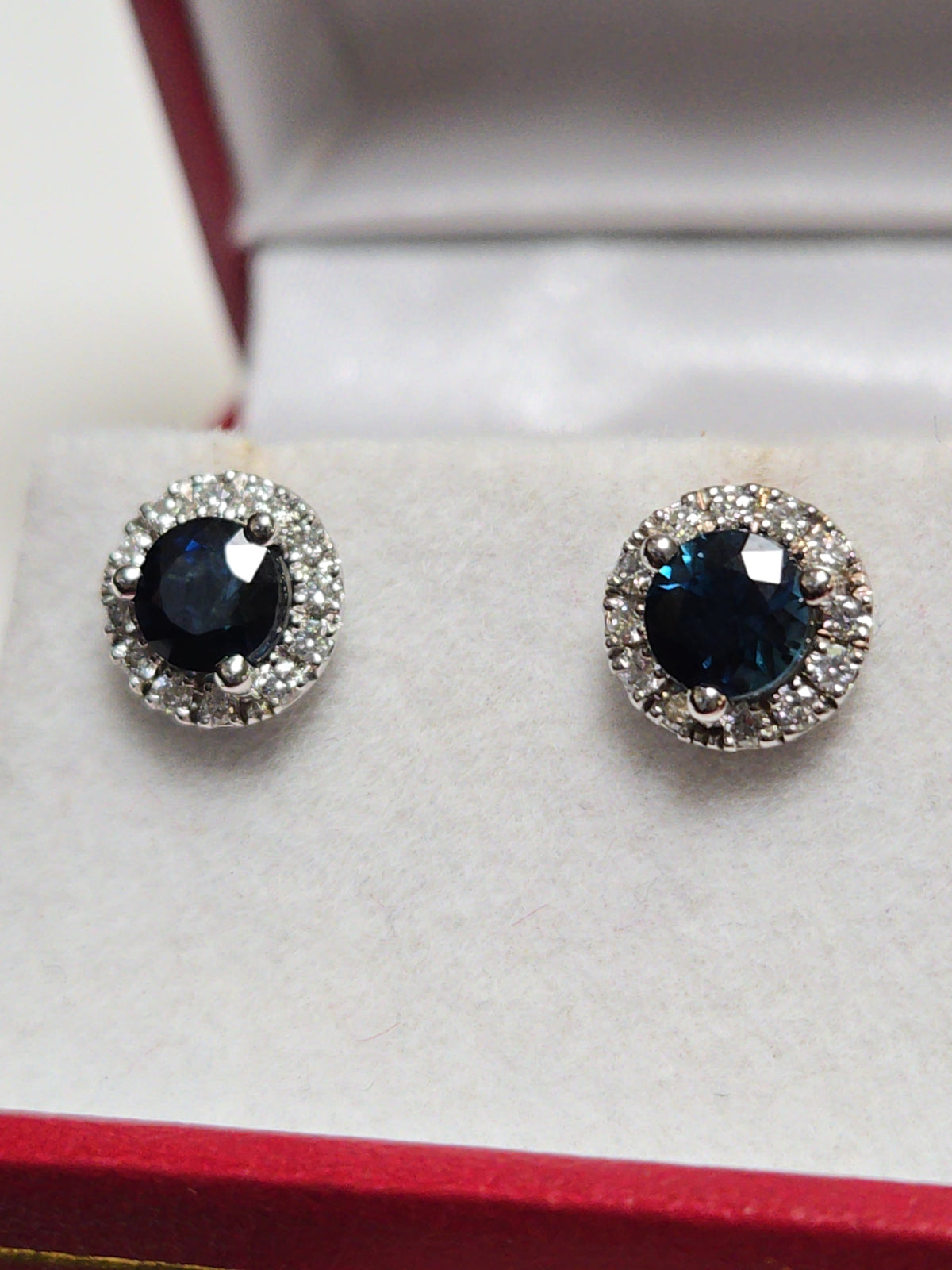 14K white gold two-stone stud earrings with 1.56ct round blue sapphires, from Chique Jewelry, featuring elegant gemstone setting.