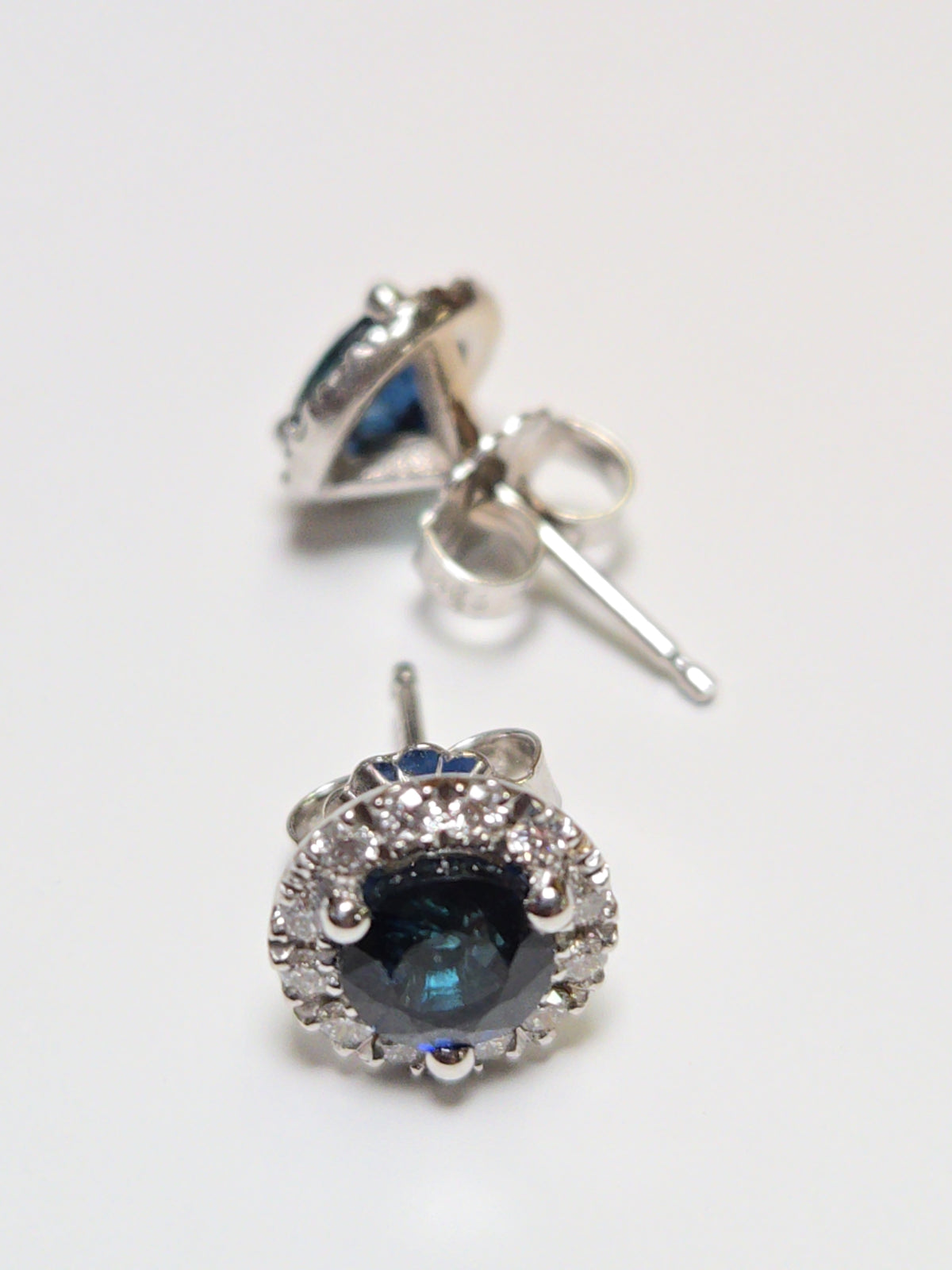 14K white gold two-stone stud earrings with 1.56ct round blue sapphires from Chique Jewelry.
