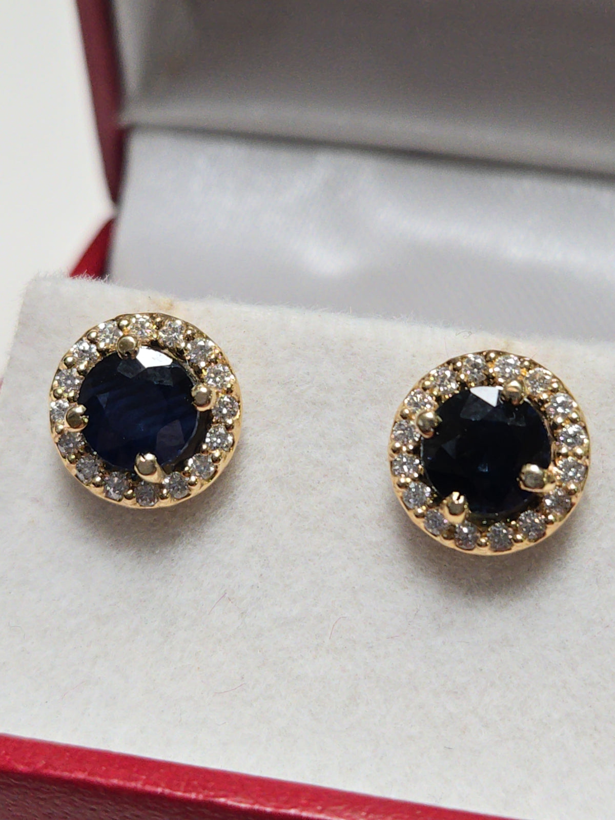 14K gold two-stone stud earrings featuring 2.45ct round blue sapphires by Chique Jewelry, showcasing elegant jewelry design.