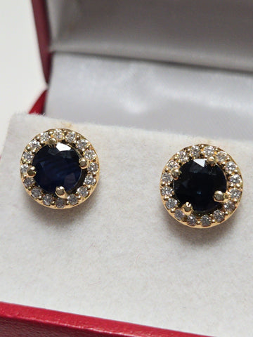 14K gold two-stone stud earrings featuring 2.45ct round blue sapphires by Chique Jewelry, showcasing elegant jewelry design.