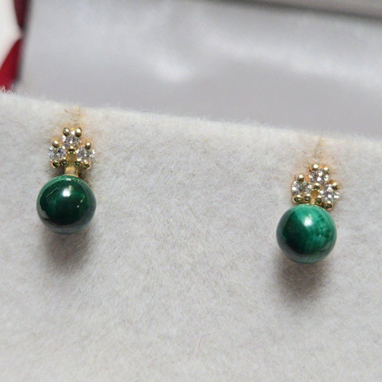 14K rose gold stud earrings with round malachite gemstones from Chique Jewelry, showcasing elegant jewelry design.