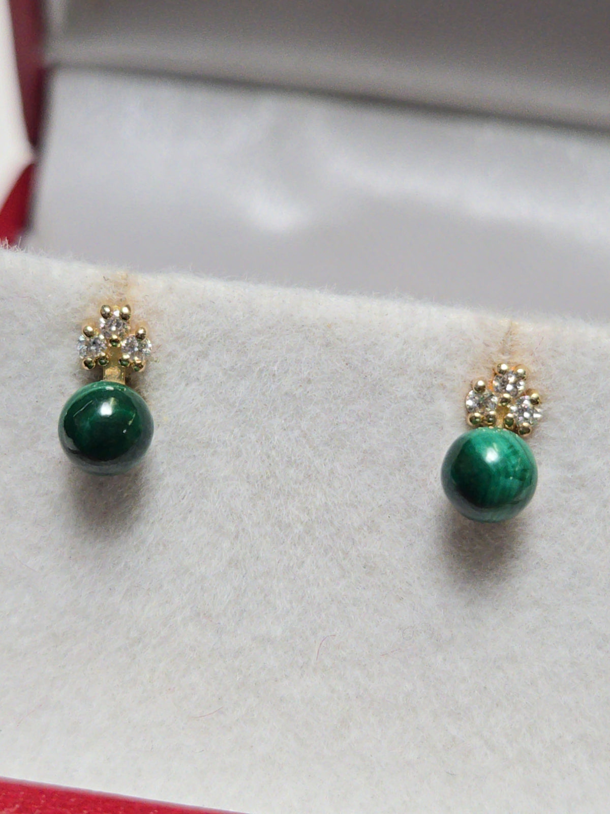 14K rose gold stud earrings with round malachite gemstones from Chique Jewelry, showcasing elegant jewelry design.