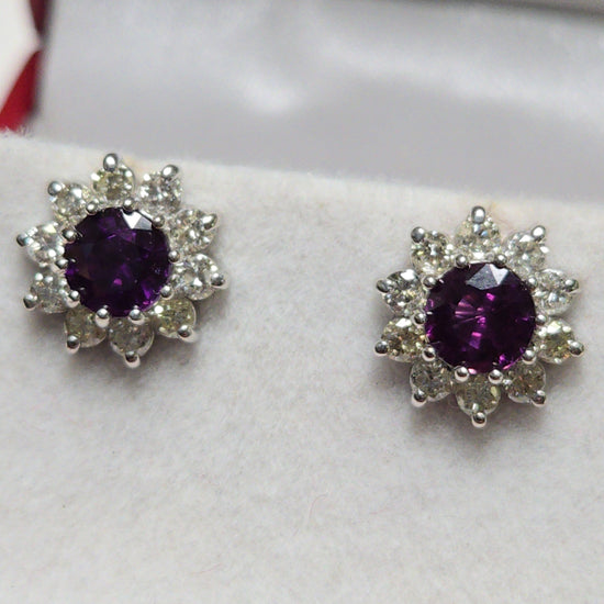 14K white gold two-stone stud earrings featuring 1.7ct round red sapphires from Chique Jewelry.