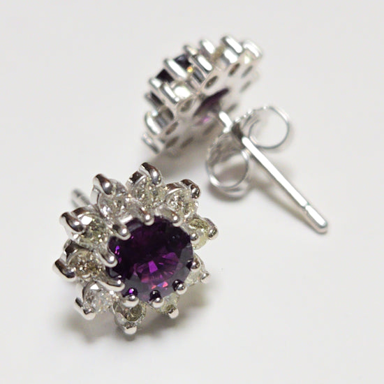 14K white gold two-stone stud earrings featuring 1.7ct round red sapphires, from Chique Jewelry, with a sleek and elegant design.