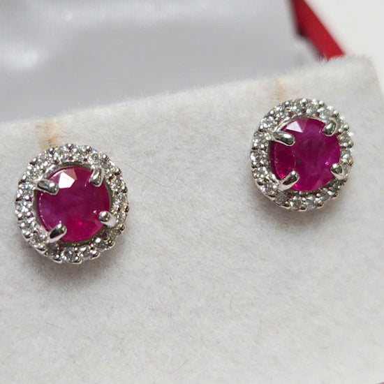 14K white gold two stone stud earrings with 1.3ct round rubies from Chique Jewelry, featuring a simple, elegant design.