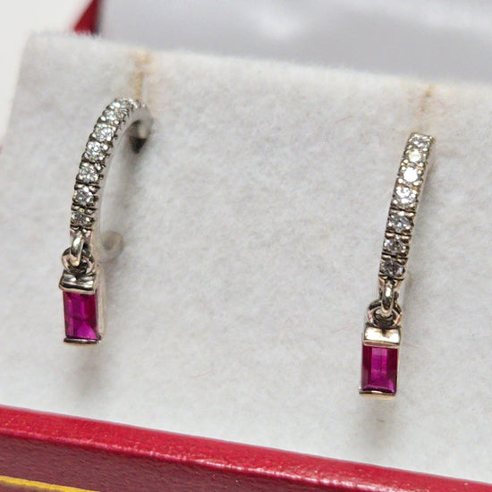 14K white gold hoop earrings featuring 0.24ct emerald-cut ruby accents, elegant jewelry from Chique Jewelry.
