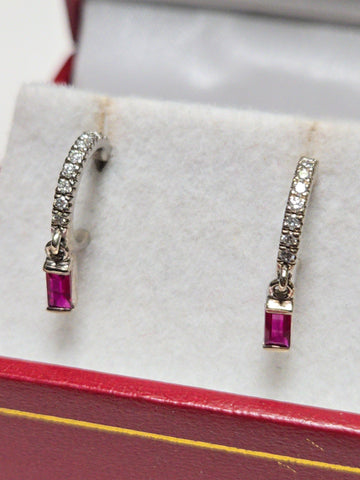 14K white gold hoop earrings featuring 0.24ct emerald-cut ruby accents, elegant jewelry from Chique Jewelry.