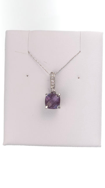14k white gold pendant with 1.35 ct lab-created round alexandrite showing extreme color change, from Chique Jewelry.