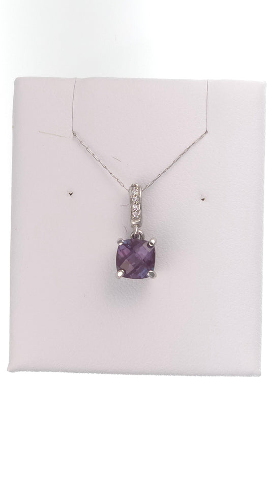 14k white gold pendant with 1.35 ct lab-created round alexandrite showing extreme color change, from Chique Jewelry.