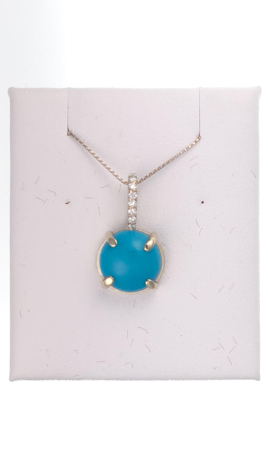 14k white gold pendant featuring a 2 ct round turquoise gemstone, displayed with a delicate chain.