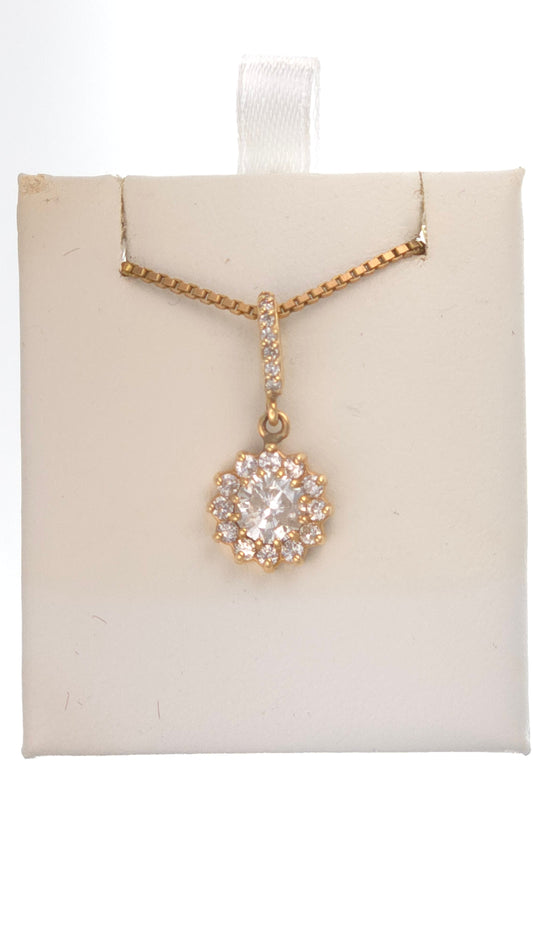 14k gold halo pendant featuring a 0.75 round diamond and 0.25 ct side diamonds by Chique Jewelry.