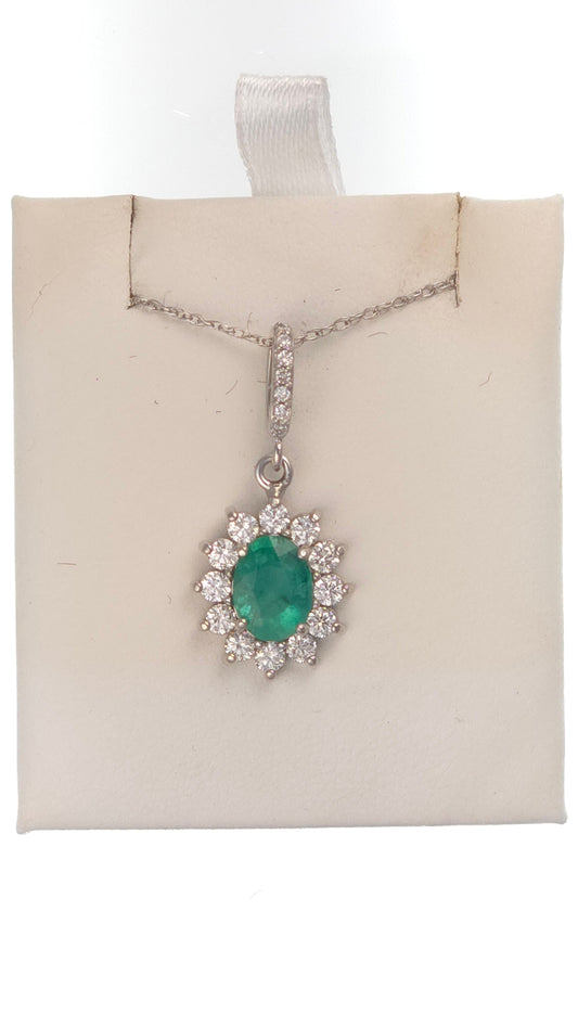 14k white gold pendant featuring a 1.05 ct oval emerald and side diamonds, designed by Chique Jewelry.