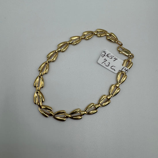 8-inch 14k gold link bracelet with 6.5mm links, weighing 7.3 grams, from Chique Jewelry, shown in the image.