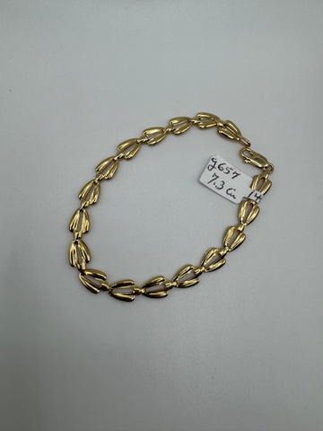 8-inch 14k gold link bracelet with 6.5mm links, weighing 7.3 grams, from Chique Jewelry, shown in the image.