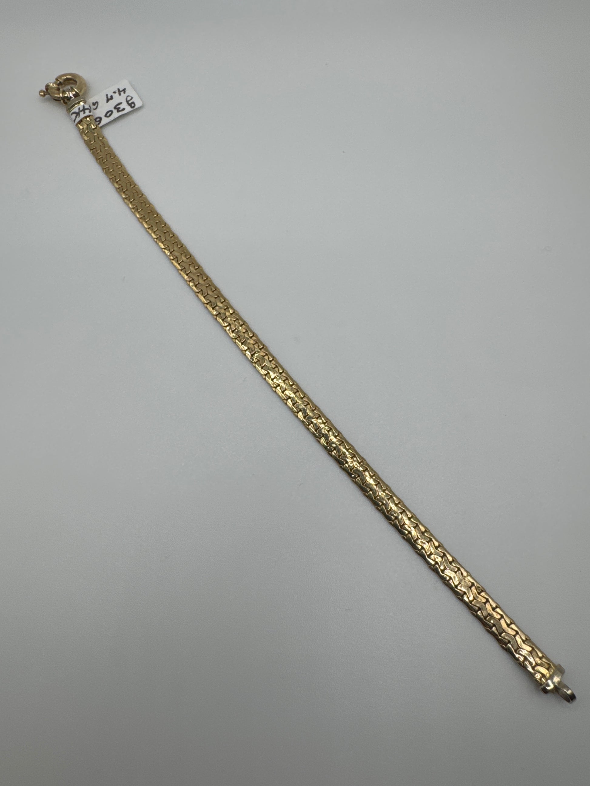 14k gold hammer bracelet, 7.5 inches long with 4.8mm width, featuring a textured design and weighing 4.7 grams.