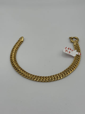 7.5-inch 7mm gold mesh bracelet by Chique Jewelry, showcasing a sleek 14k gold design with a 7.5g weight.