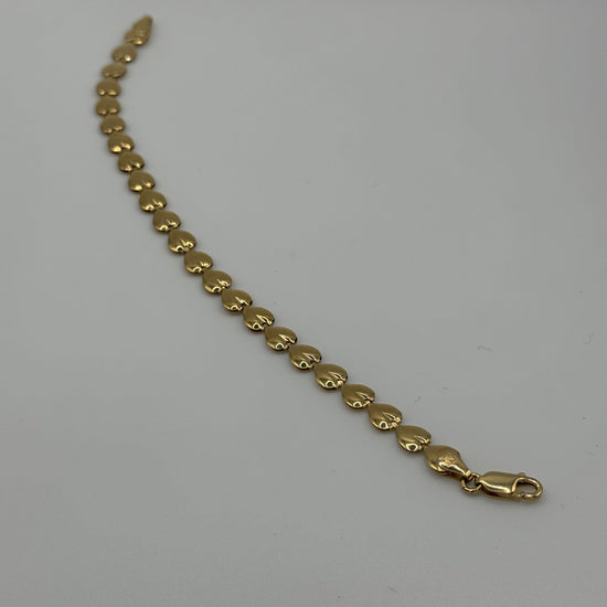 7-inch 14k gold link bracelet with 5.8mm width from Chique Jewelry, showcasing a polished chain design.