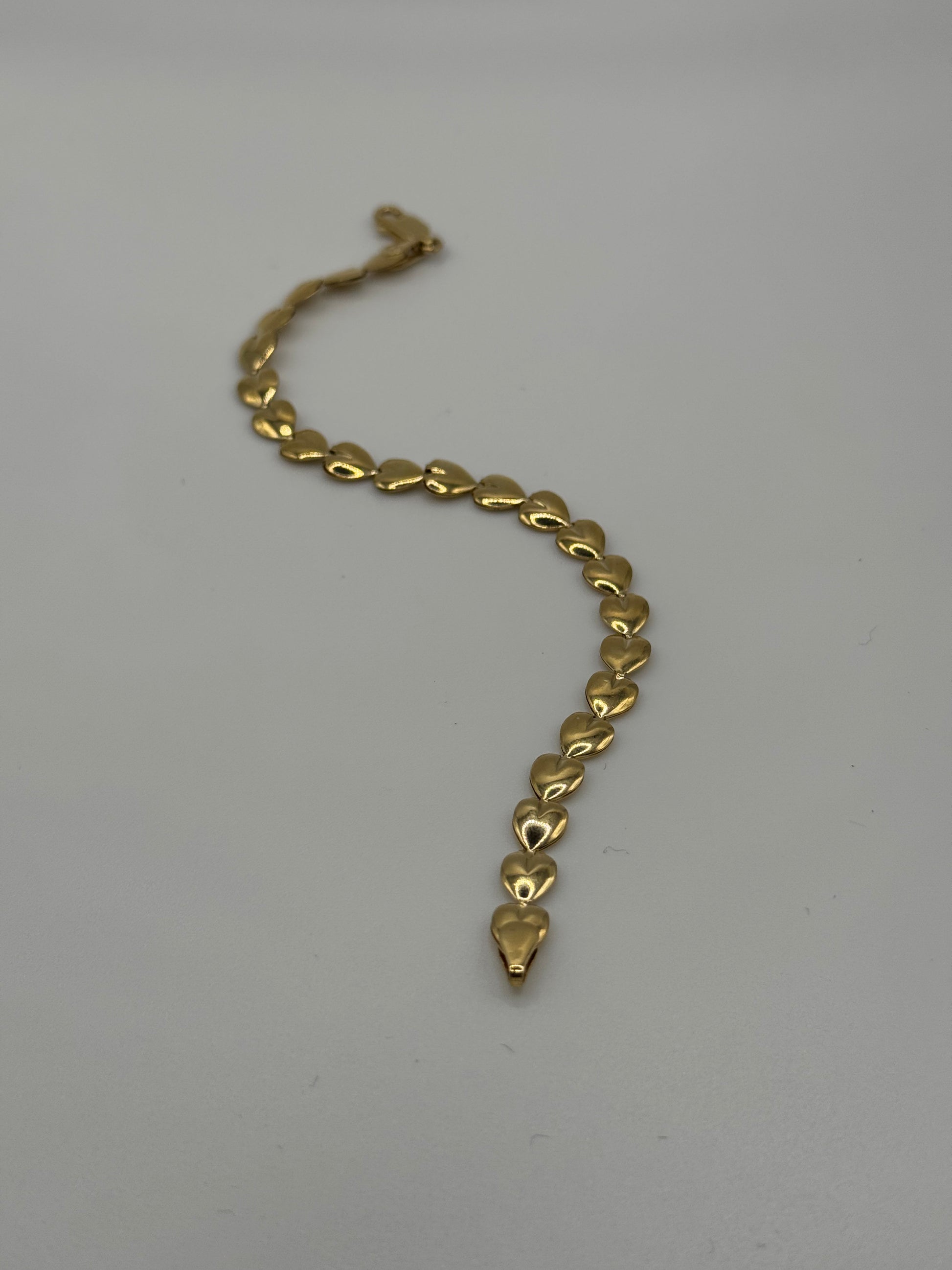 14k gold 7-inch 5.8mm link bracelet by Chique Jewelry, featuring a polished gold finish and secure clasp.