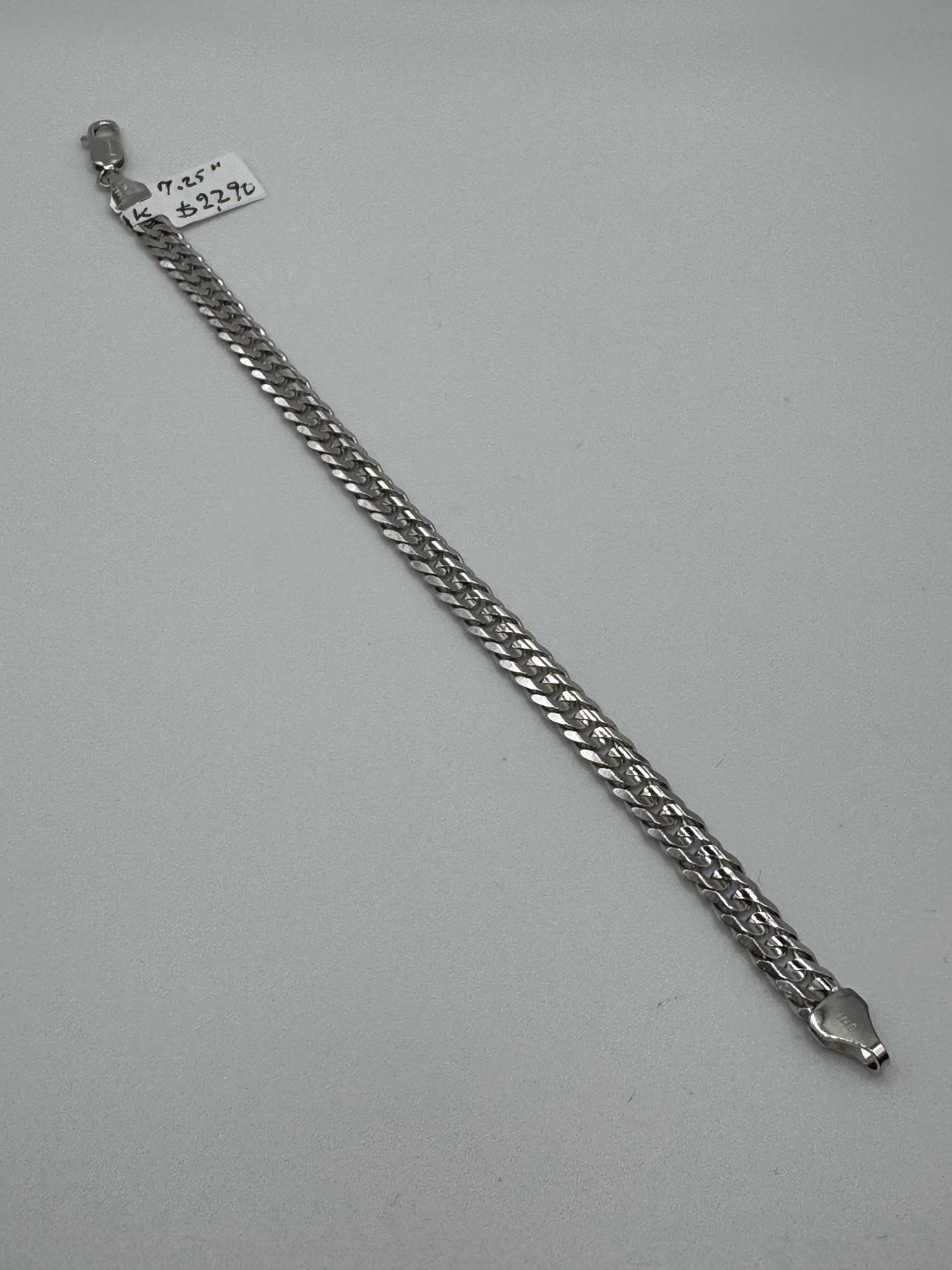 7.25-inch 14k white gold chain bracelet with 5.8mm links, designed by Chique Jewelry, weighing 11.1 grams.