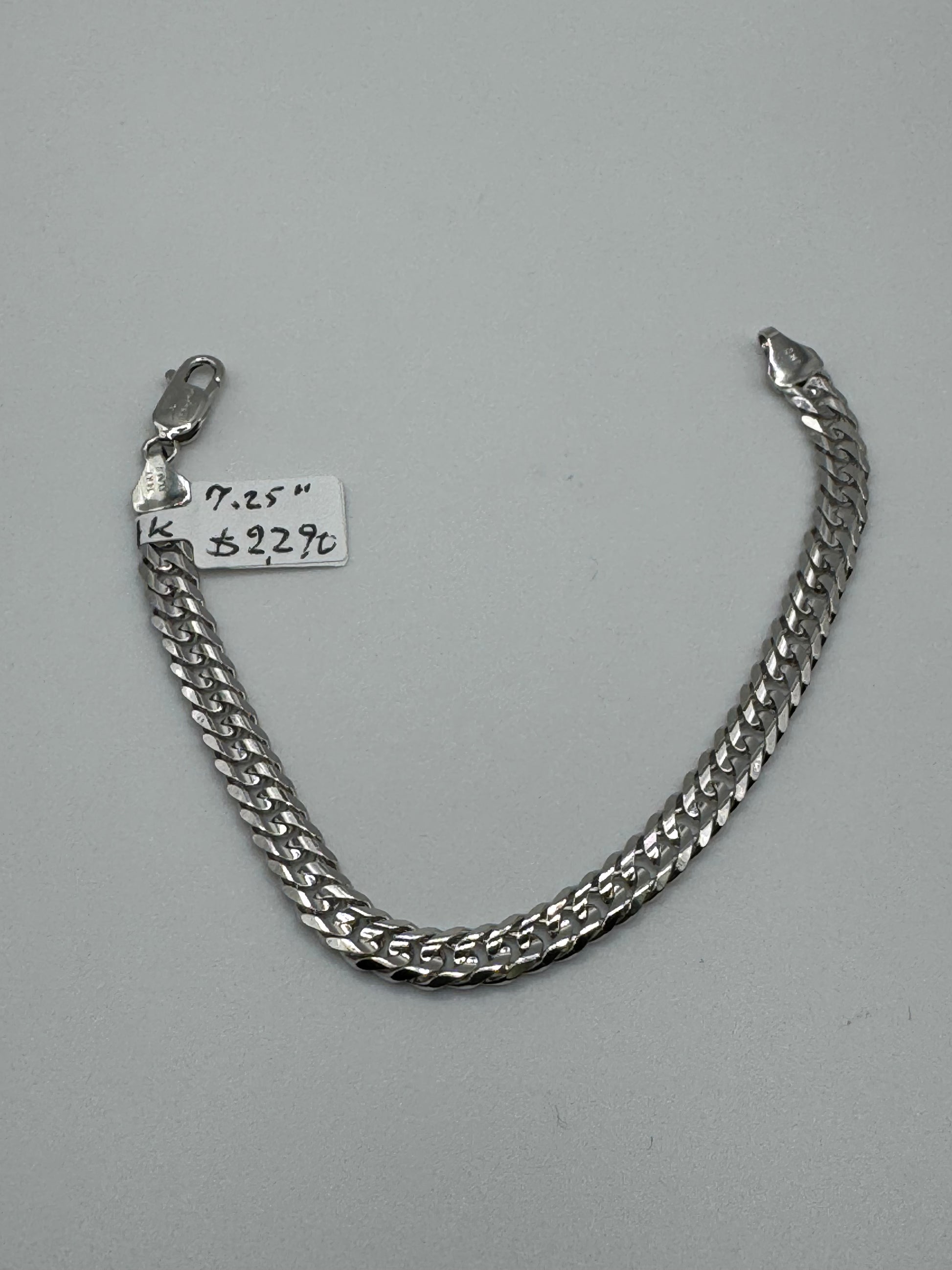 7.25-inch 14k white gold chain bracelet with 5.8mm links, weighing 11.1 grams, by Chique Jewelry.