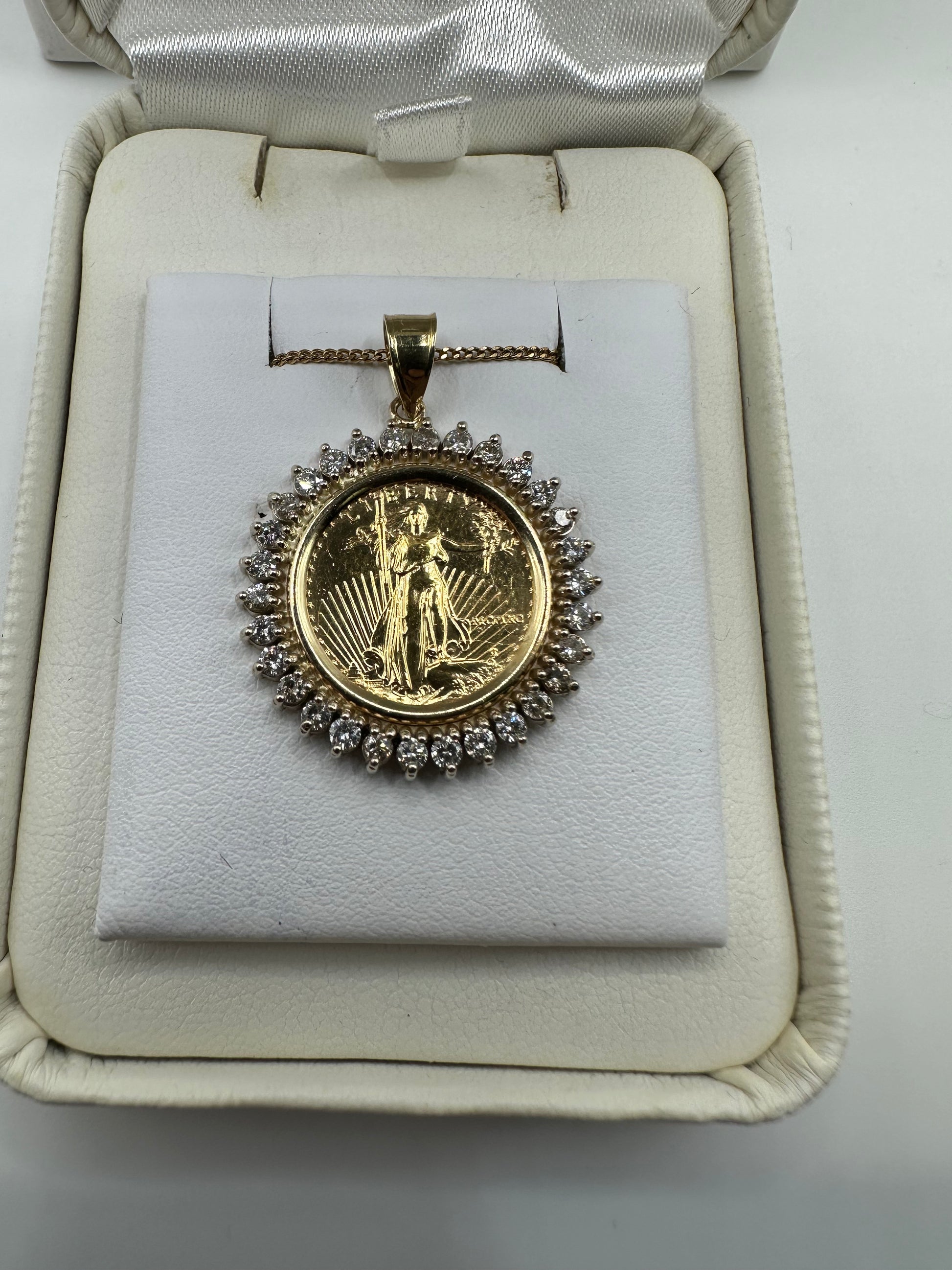 Gold Liberty coin pendant with 1.00 ct natural H-SI2 diamonds, crafted by Chique Jewelry, weighing 7.4 grams.