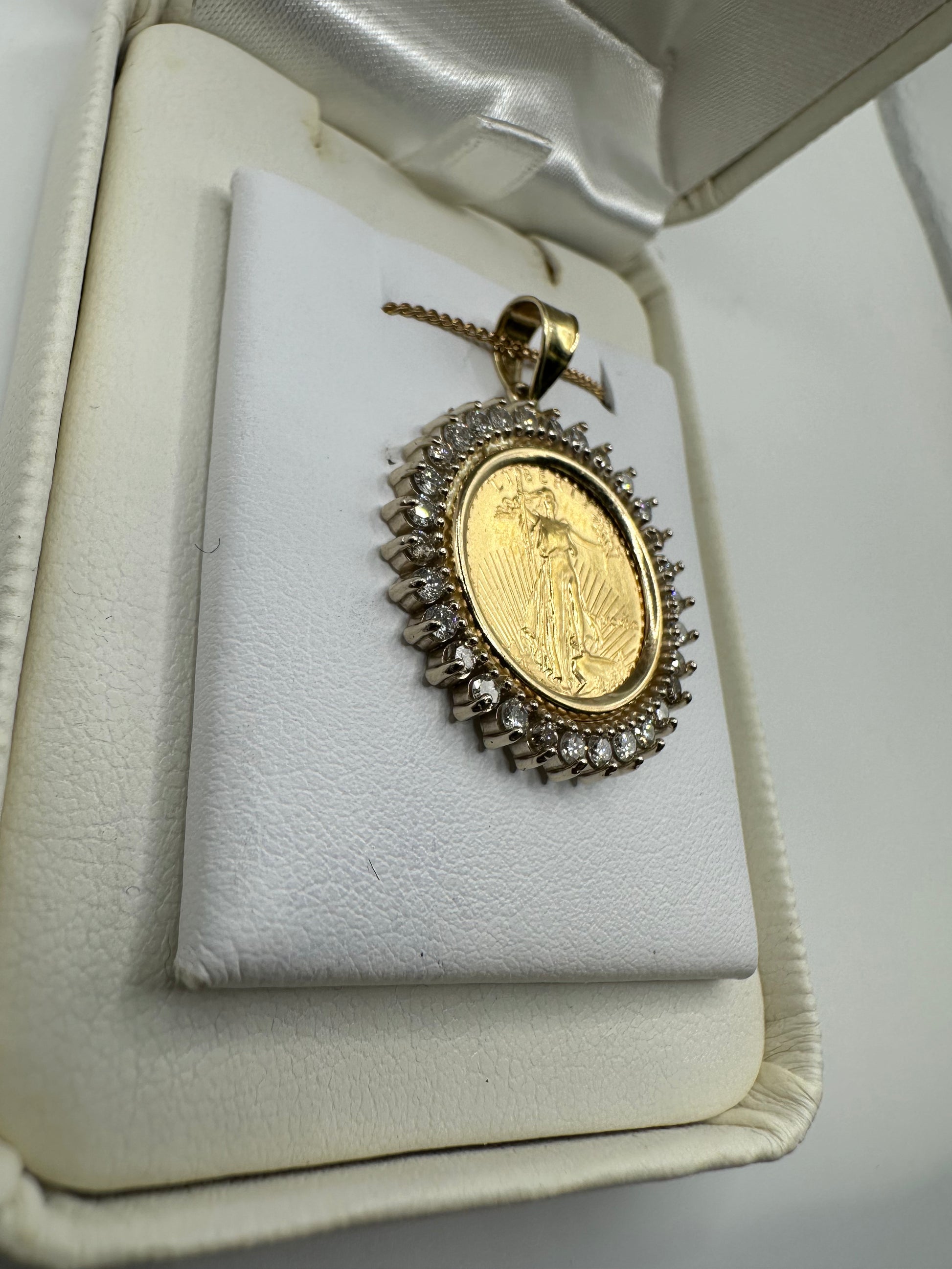 14k gold Liberty coin pendant with 1.00 ct natural diamonds, H-SI2 clarity, weighing 7.4g, from Chique Jewelry.
