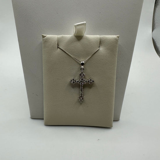 Sterling silver diamond cross pendant with 0.50 ct VVS diamonds, elegant jewelry accessory, weighs 2 grams.