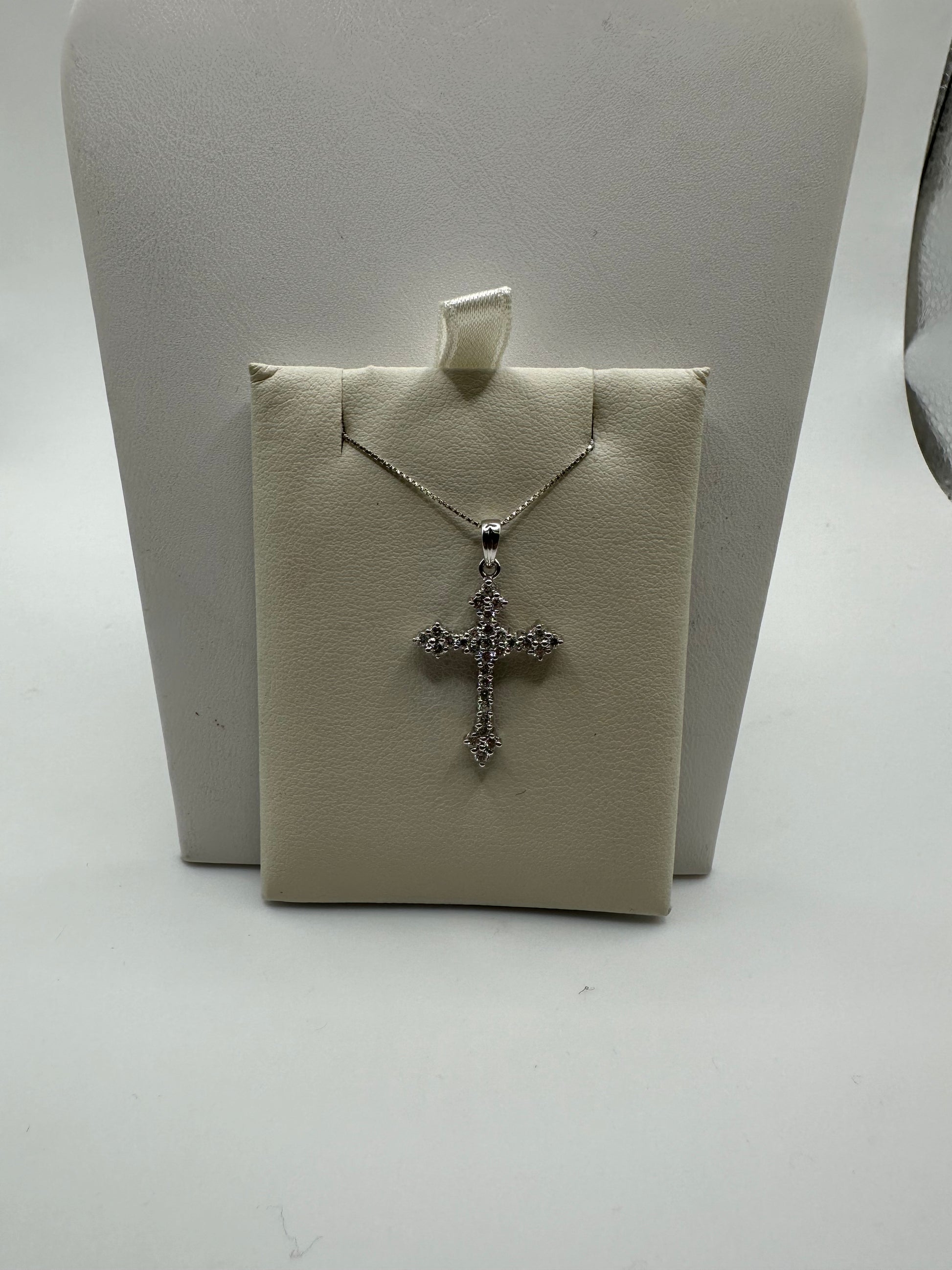 Sterling silver diamond cross pendant with 0.50 ct VVS diamonds, elegant jewelry accessory, weighs 2 grams.