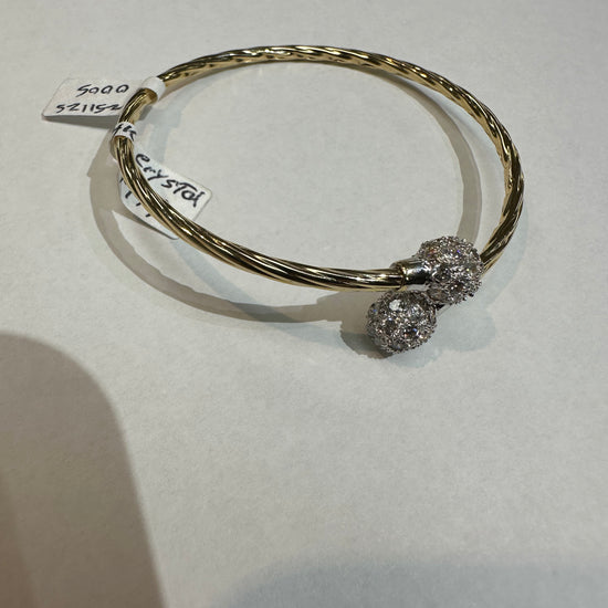 14k gold bangle bracelet with crystal accents from Chique Jewelry, showcasing a sleek, elegant design and polished finish.